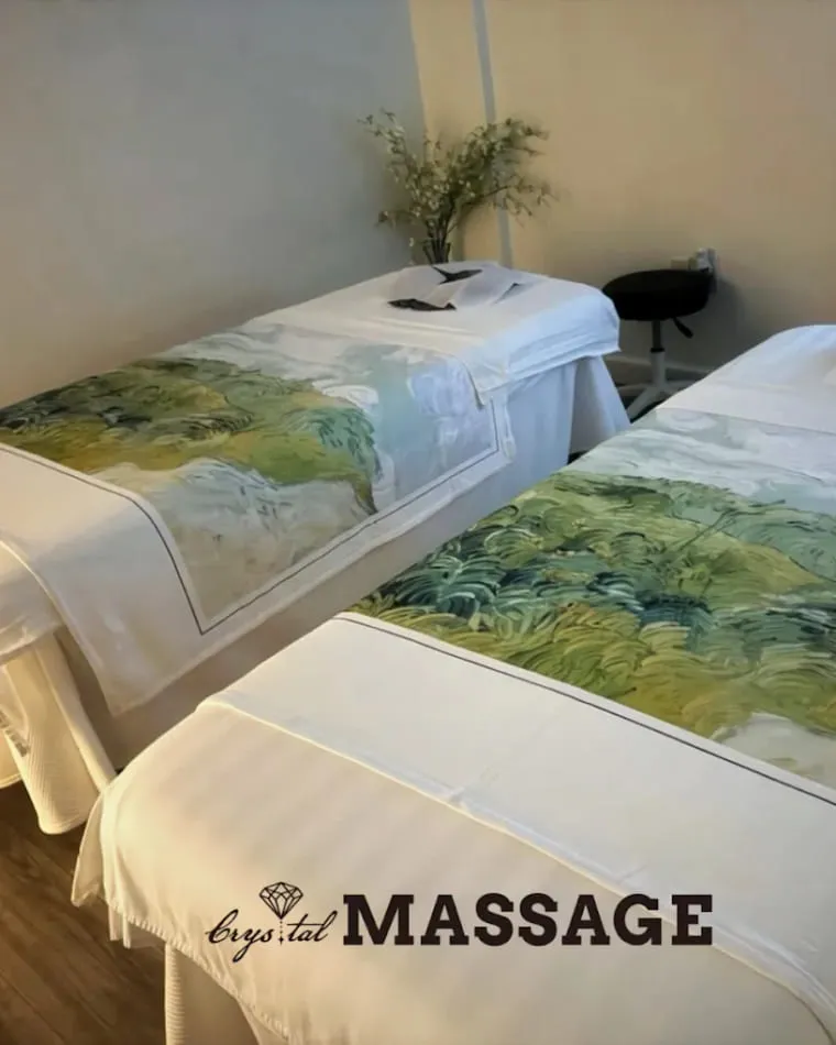 Two massage tables side by side in the couples room at Crystal Massage