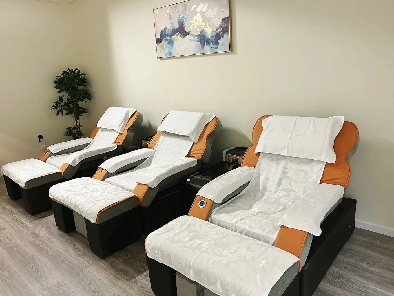 Three reclining foot massage chairs at Crystal Massage